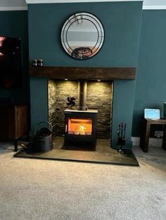 a living room with a fire place in the center and a mirror on the wall