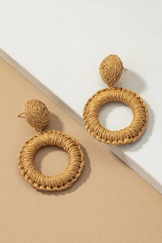 Elevate your accessory collection with our Woven Circular Raffia Drop Earrings. These unique and captivating earrings are a true embodiment of natural beauty and contemporary style. Handcrafted with precision, these earrings feature a delicate circular design intricately woven with raffia, showcasing the artistry of skilled artisans. The use of raffia not only adds an earthy and textural element but also reflects a commitment to sustainable fashion. At a length of 2.5", these drop earrings strik Raffia Earrings, Paper Circle, Circular Design, Form Fitting Dress, Online Clothing Boutiques, Natural Forms, Circle Earrings, Neutral Tones, Contemporary Fashion