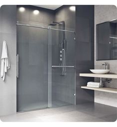 a bathroom with a sink, mirror and shower stall