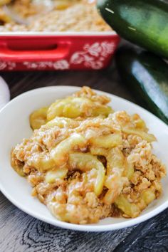 a white plate topped with brown sugar zucchini and an eggplant casserole