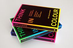 three books stacked on top of each other with the words think in color printed on them