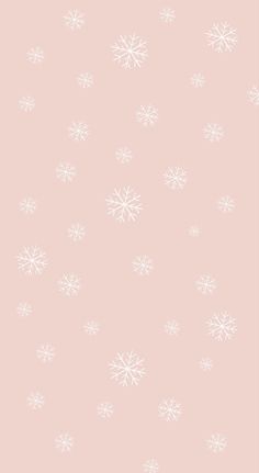 a pink background with white snowflakes on it