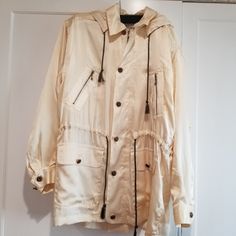 Beautiful Silk Jacket, Light Weight, Detailed Accent Buttons, Hood Is Removable, 24"Bust, 21"Waist, Tie String Waist You Can Synch, Would Fit A M/L Cream Windbreaker With Pockets For Fall, Beige Casual Long Sleeve Raincoat, Casual Beige Long Sleeve Raincoat, Casual Beige Raincoat For Outdoor, Long-sleeved Travel Parka With Pockets, Beige Long Sleeve Raincoat With Pockets, Travel Parka With Pockets, Cream Outerwear With Double-lined Hood For Outdoor, Cream Long Sleeve Hooded Outdoor Jacket