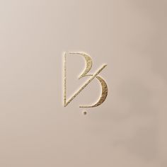 the letter b is made up of gold glitter and has a small diamond in it