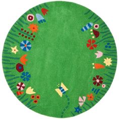 a green rug with colorful designs on it