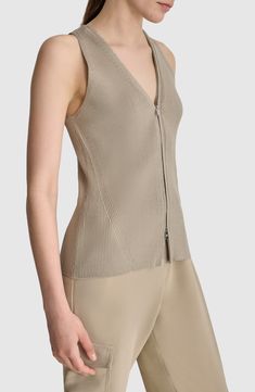 A two-way front zipper heightens the modern appeal of a ribbed sweater-vest that's ideal for layering or standalone wear. Two-way front-zip closure V-neck 80% rayon, 20% nylon Hand wash, dry flat Imported Spring V-neck Top With Zipper Closure, V-neck Tops With Zipper Closure For Spring, Spring V-neck Tops With Zipper Closure, Fitted V-neck Tops With Zipper Closure, Fitted Tops With Asymmetrical Zipper Closure, Spring Fitted Vest With Zipper Closure, Modern Tops With Zipper Closure For Work, Chic Spring Tops With Invisible Zipper, Fitted Tops With Zipper Closure For Layering