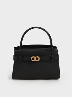 This product is made with at least 20% sustainable materials by weight. CHARLES & KEITH uses recycled, degradable, organic, and water-based materials in our eco-conscious collection.For an enduring style that will last you more than a few seasons, our Aubrielle top-handle bag is a must-have. Classy and compact, this sumptuous small-sized bag is enhanced with a gold-tone buckle and topped with a curved handle. The versatile black colour is easy to match with all your outfits, while the magnetic c Charles And Keith, How To Look Expensive, Brown Leather Tote Bag, Bags Ideas, Classic Style Outfits, Buckle Top, Effortless Outfit, Brown Tote, Kitten Heel Pumps