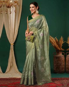 Pista Green Sequence Silk Saree  Pista Green Sequence Silk Saree is a glamorous and sparkling piece. The rich silk fabric drapes beautifully, creating a luxurious and elegant look. The intricate sequence work, which can be arranged in various patterns like floral motifs, geometric designs, or abstract shapes, adds a dazzling shimmer to the saree  Features Of Pista Green Sequence Silk Saree  Traditional Handloom Craft  Intricate Gold Brocade Work  Durability and Longevity   Size Fit  The model height is 5.7 ft   WASH AND CARE  Hand Wash only. Do not dry in direct sunlight    Legal Disclaimer:  The product is guaranteed to be 100% genuine. Product images are for illustrative purposes only. Images/packaging/ labels may vary from time to time due to changes made by the manufacturer's manufactu Saree Traditional, Pista Green, Gold Brocade, Navratri Special, Sequence Work, Draped Fabric, Packaging Labels, Floral Motifs, Geometric Designs