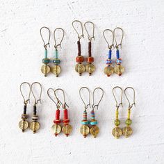 Colorful Bohemian Dangle Earrings. Antique brass earrings to add fun to your outfits.  Include African beads, Venetian, Turquoise, and old seed beads.  Colors include sage green, brown, royal blue with red, black, rustic red, turquoise and yellow green.  Sold by pair, select color at checkout. Light weight, easy to wear, 2.00" x .50".  Featured on antique brass latch backs.  They will arrive in a gift box.  These beauties will offer years of enjoyment. *Size* Length is 2.00 inches Width is .50 i Brass Beaded Drop Earrings For Pierced Ears, Adjustable Multicolor Brass Earrings, Multicolor Beaded Brass Earrings As Gift, Multicolor Beaded Brass Earrings For Gift, Beaded Brass Drop Earrings, Multicolor Brass Beaded Earrings As Gift, Multicolor Dangle Beaded Brass Earrings, Multicolor Brass Beaded Earrings For Gift, Multicolor Brass Dangle Beaded Earrings