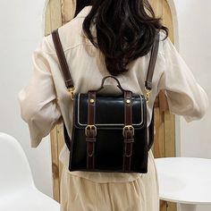 Faux leather boxy satchel bag with adjustable buckle and detachable straps that allows it to be carried as a backpack or crossbody shoulder bag. Magnetic closure with zip up main compartment. 21cm x 21cm x 10cm 8.26" x 8.26" x 3.93" Square Satchel With Zipper Closure For School, School Satchel Flap Bag With Adjustable Strap, Trendy Student Satchel With Adjustable Strap, Square School Satchel With Zipper Closure, Leather Satchel Backpack With Hasp Closure, Trendy Rectangular Leather Backpack With Adjustable Strap, Trendy Leather Backpack With Detachable Strap For School, Rectangular Satchel With Adjustable Strap For Students, Student Rectangular Satchel With Adjustable Strap