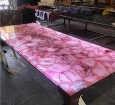 a table that has some kind of pink marble on it