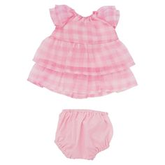 The Pretty in Pink two-piece outfit from the Baby Stella collection by Manhattan Toy features a gingham organza tiered dress with flutter sleeves, gathered neck and lined with pink cotton. Also, comes with matching pink cotton bloomers with an elastic waist band. Doll clothing set will fit all 15" Baby Stella dolls, with a simple fabric hook and loop closure for little hands to easily change. Baby Stella is an ideal first baby doll collection that will encourage little ones to role play, nurture Pink Two Piece Outfit, Pink Baby Doll Dress, Baby Stella Doll, Dress For 15, Baby Stella, Bday Wishlist, Simple Fabric, Pink Two Piece, Baby Doll Dress