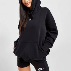 Level Up Your Laidback Rotation With This Women's Oversized Hoodie From Nike. In A Black Colourway, This Baggy-Fitting Hoodie Is Cut From Soft, Fleecey Fabric For Total Comfort. It Features An Adjustable Hood For Custom Coverage, With Ribbed Trims To Lock In The Fit And A Kangaroo Pouch For Your Everyday Essentials. Finished Up With Nike Swoosh Branding To The Chest. Nike Black Hoodie Outfit, Oversized Long Sleeve Nike Hoodie, Oversized Black Nike Hoodie, Nike Black Cotton Hoodie, Nike Sweatshirts Hoodie, Nike Jumper, Nike Long Sleeve Hoodie With Moisture-wicking, Black Hoodie Outfit, Nike Hoodie Outfit