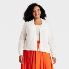 This Button-Up Cardigan from Universal Thread™ adds a chic staple to your cool-weather wardrobe. Designed in a classic shaker-knit pattern with ribbed edges, this long-sleeve cardigan is made from midweight cotton for comfortable wear. It's tailored in a casual fit with a long-length silhouette and features a flattering deep V-neckline and a full-length button-down placket that can be worn buttoned or unbuttoned. Universal Thread™: Found exclusively at Target. Spring Ribbed Button-up Outerwear, Spring Daywear Ribbed Cardigan, Ribbed Cardigan For Spring Daywear, Spring Ribbed Cardigan For Daywear, Casual Ribbed Cardigan For Daywear, Spring Sweater With Button Closure And Relaxed Fit, Button Closure Cardigan For Fall Daywear, Fall Daywear Cardigan With Button Closure, Classic Sweater With Button Closure For Fall Daywear