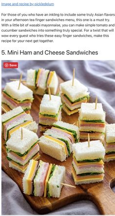 mini sandwiches are arranged on a cutting board