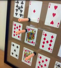 a framed playing card game with fours and fives on it's sides