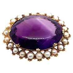 Centering a large oval amethyst weighing approximately 66.00 carats, the scalloped frame accented with split-pearls, in 18k gold Weight: 20.2 grams Brooch measuring 45 x 37 mm Amethyst of a medium tone of strong purple colour, good clarity, good cut, some colour zoning, as is commonly found in natural amethyst Pearls medium to strong cream colour, medium to bright lustre, pink overtones, not tested natural origin Good condition Colour Zoning, Antique Jewellery Designs, Color Crema, Gold Brooch, Purple Colour, Cream Colour, Gold Brooches, Amethyst Jewelry, Victorian Jewelry