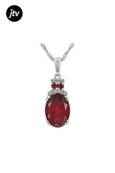 5.40ct Oval Hessonite Garnet , 0.09ctw Vermelho Garnet���, 0.09ctw Round White Zircon Pendant With 18"Singapore Chain. Measures Approximately 1.06"L x 0.37"W. 3mm bail. Lobster clasp with 2"extender. Accent stones primarily zircon. Oval Diamond Gemstones With Accents, Diamond Jewelry With Accent Stones Oval Pendant, Oval Pendant Diamond Jewelry With Accent Stones, Diamond Jewelry With Accent Stones In Oval Pendant, Oval Diamond Pendant With Accent Stones, Oval White Gold Jewelry With Gemstone Accents, Oval Gemstones With Diamond Accents In Sterling Silver, Hessonite Garnet, Pendant With Chain