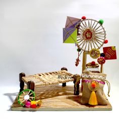 a wooden bench with an umbrella and other decorations