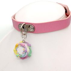 Details:- choker adjustable 12-15" length (1/2" wide) -Pink Vegan leather-Choker closes with snap buttons-beautifully detailed pastel rainbow birthday cake-round cake frosted with vanilla buttercream and piped rainbow buttercream edges & lacy frosting decoration around the middle and topped with classic rainbow confetti sprinkles. -Glossy finish, durable-cake is 1.20" wide by 1/2" tallWant this on a chain? It's available in my shop! http://etsy.com/shop/fatallyfeminine**Made to Order- Please Adjustable Rave Choker For Gift, Adjustable Rave Choker For Gifts, Adjustable Rave Choker As Gift, Adjustable Rave Style Choker, Cute Adjustable Choker For Parties, Adjustable Cute Pink Choker, Adjustable Pink Choker For Festivals, Adjustable Multicolor Rave Choker, Cute Pink Choker For Party