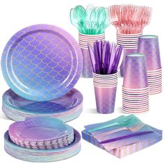 there are many different colored plates and cups on this tableware set, including one with mermaid tails