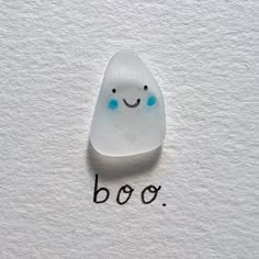 a rock with the word boo written on it