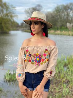 This Beautiful Off the Shoulder Crop Top is the perfect Top for a fun day out. It's made out of cotton, has an elastic waist and has hand embroidered florals. This blouse is hand embroidered and the embroidered colors vary on each blouse making each blouse one of a kind. More colors available here: https://www.etsy.com/es/listing/855531148/crop-top-manga-larga-blusa-artesanal?ref=listings_manager_grid Purchase the Artisanal Mexican earrings modeled here: https://www.etsy.com/es/listing/802949597 Summer Embroidered Blouse For Day Out, Multicolor Cotton Summer Blouse, Summer Cotton Blouse In Multicolor, Summer Multicolor Cotton Blouse, Multicolor Cotton Blouse For Summer, Embroidered Summer Top For Spring, Summer Embroidered Cotton Top For Day Out, Embroidered Spring Tops For Summer, Embroidered Cotton Blouse For Beach