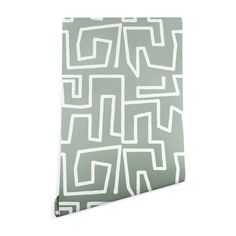 a green and white wallpaper with an abstract design on the bottom half of it