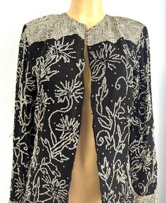 This lace blazer coat is all hand beaded with sequins perfect for parties and special events. Elegant Holiday Sequin Outerwear, Glamorous Sequin Outerwear For Evening, Glamorous Sequined Evening Outerwear, Fitted Sequin Outerwear For Holidays, Elegant Embellished Outerwear For Party, Elegant Sequin Blazer For Party Season, Elegant Festive Sequin Blazer, Festive Embellished Evening Blazer, Elegant Sequin Blazer For Festive Occasions