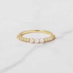 Beautiful pave band with three dainty pearls. So dainty and chic, it looks so cute on its own or stacked with other rings! - - - D E T A I L S - - - * Made of 925 Sterling Silver * THICK plating of 14k Gold or Rhodium * Available in Sizes 6, 7, 8, or 9 * Ring width: 2mm * Will NOT turn fingers green * Nickel-free & Hypoallegenic Made with 100% Pure Love 💜 Ring Sizer- https://www.etsy.com/listing/1240904225/ring-sizer-reusable-ring-sizer-plastic?click_key=f93d1ab266e67efb3e3db4839cb55bfeb500cb3b Three Pearl Ring, Minimalist Rings Simple, Recreate Outfits, Pearl Ring Gold, Minimalist Ear Cuff, Silver Pearl Ring, Eternity Ring Gold, Gold Pearl Ring, Simple Ring