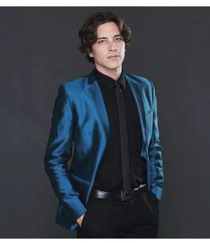 a man in a blue jacket and black shirt