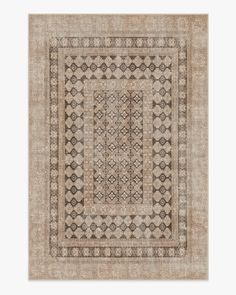 a beige and black rug with an intricate design on the middle, in front of a white background