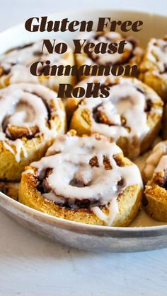 cinnamon rolls with icing in a bowl on a table