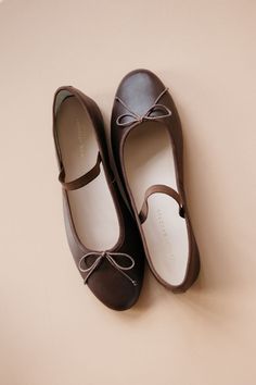 Soft ballet flat in chocolate brown Italian glove calf leather with an elastic bridge strap and bow detail. Features a padded footbed with gold stamped logo and an almond toe. Ballet Flats For Women, Movie Fits, Soft Ballet Flats, Brown Ballet Flats, Brown Leather Flats, Xmas List, Chocolate Leather, Cute Flats, Brown Flats