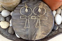 "Ankh with cowrie charm wire earrings is 3 inch long and 3 inches wide. Earrings are hammer flat for sturdiness and constructed with 16 gauge non tarnish copper, gold and silver wire. Ankh is the Egyptian symbol for \"Long Life\". Wire earrings are light weight." Nickel Free Ankh Earrings For Gift, Nickel-free Ankh Earrings As Gift, Ankh-shaped Earrings For Pierced Ears As Gift, Handmade Ankh Earrings As Gift, Ankh Shaped Metal Earrings For Gift, Ankh-shaped Metal Earrings For Gift, Handmade Adjustable Ankh Earrings, Silver Wire Earrings, Wire Earring