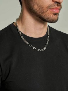 Enhance his style with our Paperclip Chain Necklace, featuring sleek curb and paperclip chains in stainless steel. Ideal for any occasion, this versatile piece complements both casual and formal looks. A perfect gift for him, it adds a sophisticated touch to his jewelry collection. Modern Metal Cuban Link Necklace With Curb Chain, Modern Metal Cuban Link Necklace, Everyday Silver Cuban Link Necklace, Modern Cuban Link Chain Necklace, Modern Metal Cuban Link Chain Necklace, Modern Stainless Steel Curb Chain Necklace, Modern Stainless Steel Cuban Link Chain Necklace, Trendy Stainless Steel Link Chain Necklace, Modern Figaro Chain Link Necklace