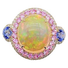 The Following Items we are offering is this Rare Important Radiant 18KT Gold LARGE Glittering and Sparkling Magnificent Fancy Multi colored Opal and Pink Sapphire Blue Sapphire White Diamond Ring. Ring Contains a Beautiful Gorgeous Large Round Opal surrounded with a Halo of Glittering Fancy Colored Pink Sapphires and Diamonds with 2 Blue Sapphires!!! Stones are Very Clean and Extremely Fine! T.C.W. Approx 7.50CTS!!! This Magnificent Ring is from a Private Top Manufacturer that sold to Important Pink Nail Colors, Blue Sapphire Diamond Ring, Dream Rings, White Diamond Ring, Blue Sapphire Diamond, Sapphire Diamond Ring, Dream Ring, Sapphire Blue, Pink Opal