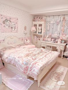 a bedroom decorated in pink and white with hello kitty wallpaper