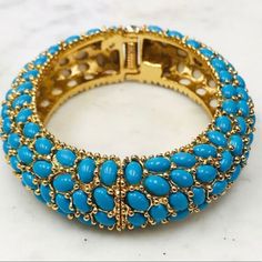 Something About The Combination Of Turquoise Stones Set Into Polished Gold, Makes This Bangle Contemporary And Timeless. This Bangle Is Perfect For Any Season. Gift Boxed. Hinged Opening 14k Gold Electroplated Adjustable Blue Oyster Bracelet Jewelry, Elegant Turquoise Bracelet For Party, Turquoise Bangle Bracelets For Party, Turquoise Bangle Bracelet For Party, Elegant Turquoise Beaded Bangle Bracelets, Elegant Turquoise Jewelry With Bracelet Strap, Turquoise Jubilee Bracelet Bangle, Blue Costume Jewelry Bracelet, Clear Sunglasses Frames