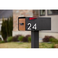 a mailbox with the number twenty four on it