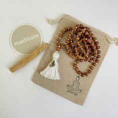 Brown Hand Knotted Mala As Gift, Brown Hand-knotted Mala As Gift, Spiritual Brown Mala For Meditation, Gift Brown Hand Knotted Mala, Brown Spiritual Mala For Meditation, Holistic Brown Mala With Wooden Beads, Holistic Wooden Beads Mala For Rituals, Holistic Hand-strung Mala For Meditation, Holistic Wooden Mala For Rituals