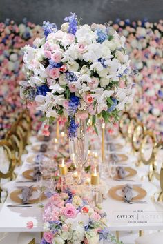 a long table with flowers and candles on it is set up for a formal function