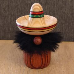 a mexican sombrero sitting on top of a wooden table