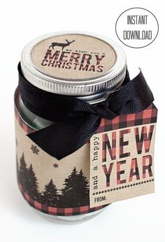 a glass jar with a black ribbon around it and a merry christmas tag on the lid