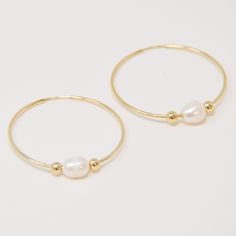 14k gold filled 40mm hoops with freshwater pearl between 4mm 14kgf beads. lightweight | lead and nickel free Minimalist White Pearl Hoop Earrings, Freshwater Pearl Hoop Earrings, Classic Gold-plated Hoop Earrings With Pearl Drop, Nickel-free Hoop Pearl Jewelry, Minimalist 14k Gold-filled Hoop Earrings With Pearl Charm, Simple Pearl, Freshwater Pearls, Gold Filled, Gold Bracelet