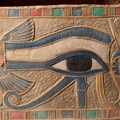 an egyptian style painting with the eye of horus