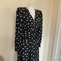 "Designer Black and White Polka Dot midi dress by Derek Lam...The  Classic midi dress has a fluid fit and features padded puff shoulders with an outside seam detail, V-neckline, long sleeves with button cuffs, and slight shirred cummerbund style waist with a gathered front detail and flowy skirt... Excellent condition with no issues....Original Price $595 Brand Label: DEREK LAM 10 CROSBY Material: 100% Polyester MEASUREMENTS Label Size 8 ...Measurements taken with Garment Flat UN Stretched...Tak Puff Shoulder Dress, Classic Midi Dress, Polka Dot Midi Dress, Derek Lam 10 Crosby, Brand Label, Derek Lam, Flowy Skirt, Long Sleeve Midi Dress, Polka Dot Dress