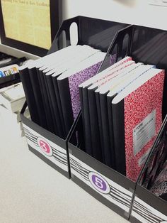 file folders are organized in an office cubicle