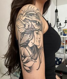 a woman with a tattoo on her arm