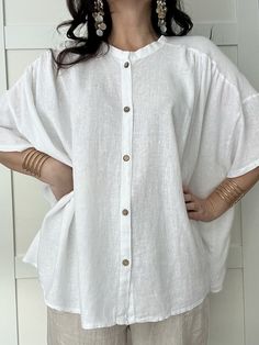 Elevate your look with this sophisticated oversized  linen shirt. Crafted from high-quality linen blend, it features a button design and is very versatile, making it perfect for any occasion. The shirt provides an airy and light feel. It's sure to become an stylish staple in your wardrobe for summer.  Available colours:  White, Dusky Pink, Pistachio. Made in Italy. One size UK 10-18 Fabric:  60% Linen 20% Cotton 20% Viscose Wash Info: Wash at 30oC Do not bleach Do not tumble dry Iron on low heat Oversized Linen Shirt With Button Closure, Oversized Linen Top With Button Closure, Oversized Blouse With Button Closure For Vacation, Oversized Blouse For Vacation With Button Closure, White Oversized Buttoned Top, Oversized Vacation Blouse With Buttons, Oversized Vacation Blouse With Button Closure, Oversized Linen Blouse With Button Closure, Oversized Buttoned Beach Shirt